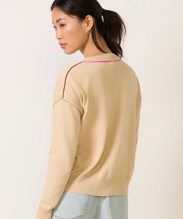 Back view of the pullover showing contrast seam lines across the shoulder