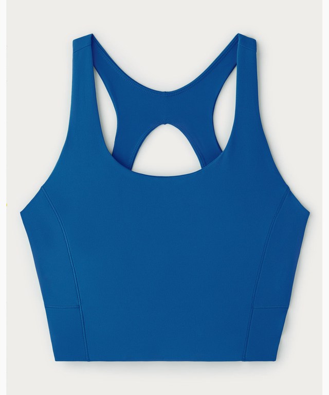 The bra laid flat, showing the racerback and keyhole opening