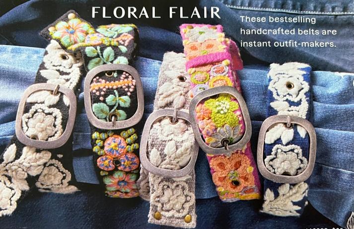The Floral Flair placement in the February catalog, showing five embroidered belts against denim