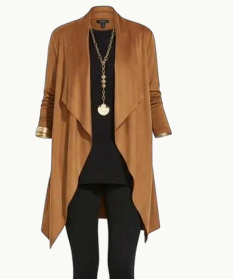 The faux suede jacket in saddle brown, worn over a black top and leggings